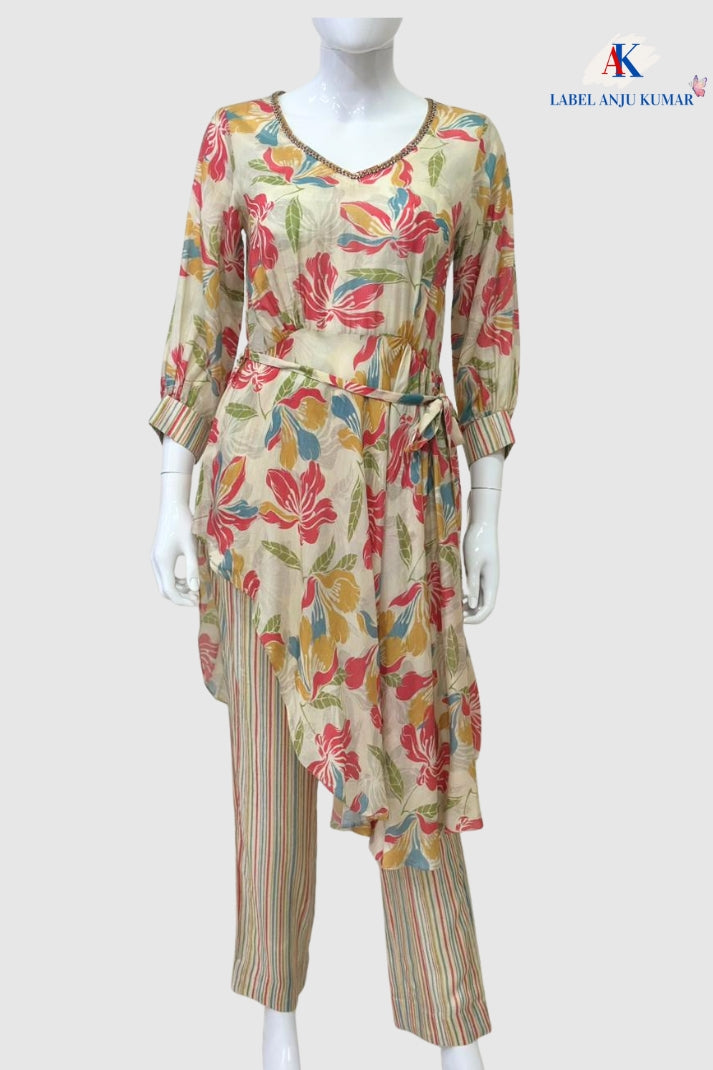 Lemon cotton printed straight suit dupatta set with V-neckline, printed trousers & malmal dupatta. Sizes S–3XL. Women’s ethnic wear by Label Anju Kumar.